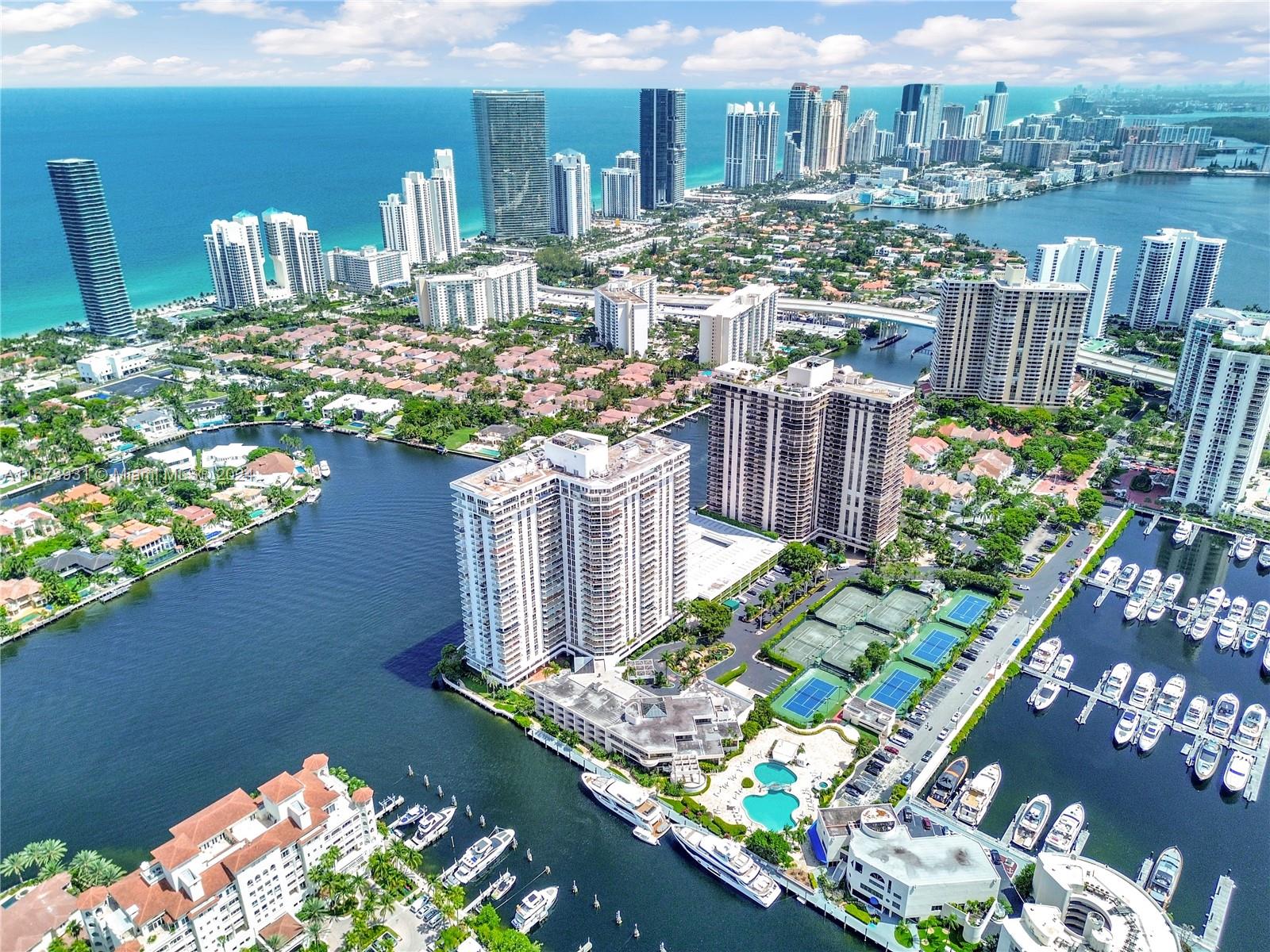 Welcome to this Mansion in the Sky, ready to move in! This spacious 4,968 sqft home, one of Aventura's largest, offers 4 bedrooms + a large den, 5 full bathrooms, and a guest powder room. Enjoy 235-degree panoramic views from a wraparound balcony connecting all rooms. White porcelain tile throughout, with each bedroom as a private suite.
Luxury amenities include a renovated gym, pool deck with bay views, a full-service restaurant, 24-hour security, party room, bicycle room, card room, and complimentary valet. Prime location near Aventura Circle, Aventura Mall, and easy access to US-1 and Collins Ave. Easy to show!