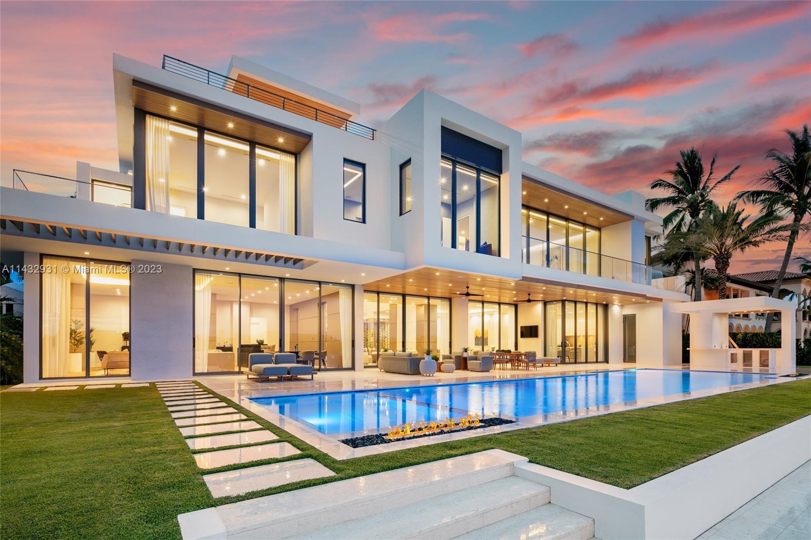 This stunning modern masterpiece boasts 6 beds, 7 full baths & 2 half baths in the highly sought after Harbor Beach gated community. This residence was designed by Randall Stofft & built to perfection by Sarkela Corp. Equipped to dock a mega yacht, this home features vast Intracoastal views that seem too good to be true with 120 ft of water frontage, a lap pool & full summer kitchen. No detail was missed with generous entertaining spaces both indoor and out, 2 master baths, DuChateau oak floors, 200 bottle wine cellar, 2-story marble fireplace, imported custom furniture + artwork, Terzani chandeliers, Italian cabinetry, Dornbracht bath fixtures, Crestron smart home system, separate prep kitchen, lounge/bar area, & full home generator creating your own resort style single family dream home.