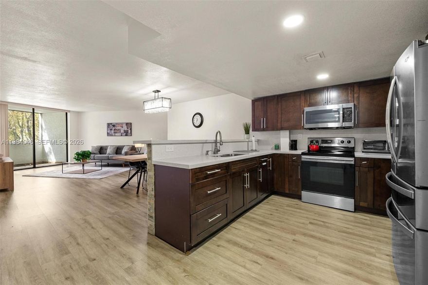 Enter homeownership with a low down payment in one of Kendall’s most well-kept communities. This fully furnished 1/1 + den features brand-new furniture, offering a true move-in-ready option ideal for first-time buyers or those looking to simplify and downsize without sacrificing comfort. Start your mornings with peaceful views of the resort-style pool and enjoy a low-maintenance lifestyle, with the association covering water, security, pool, and tennis courts. The owner-occupied community fosters a quiet, stable environment perfect for those seeking a sense of neighborhood and pride of ownership. Centrally located near Miami Dade College, Baptist Hospital, parks, shopping, dining, and with easy access to the Turnpike, everything you need is within reach. Freddie Mac & Fannie Mae approved for easy financing.