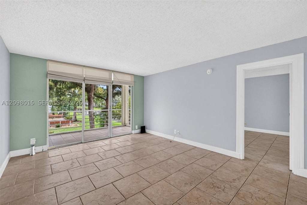 Photo of 4898 NW 29th Ct #201, Lauderdale Lakes, FL 33313 (MLS # A12098015)