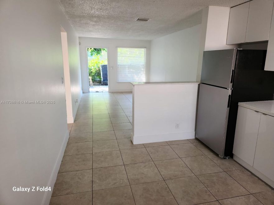 Available for immediate move-in, this charming two-bedroom, one-bathroom unit features a recently renovated kitchen and bathroom. The property offers a streamlined approval process for prospective tenants.