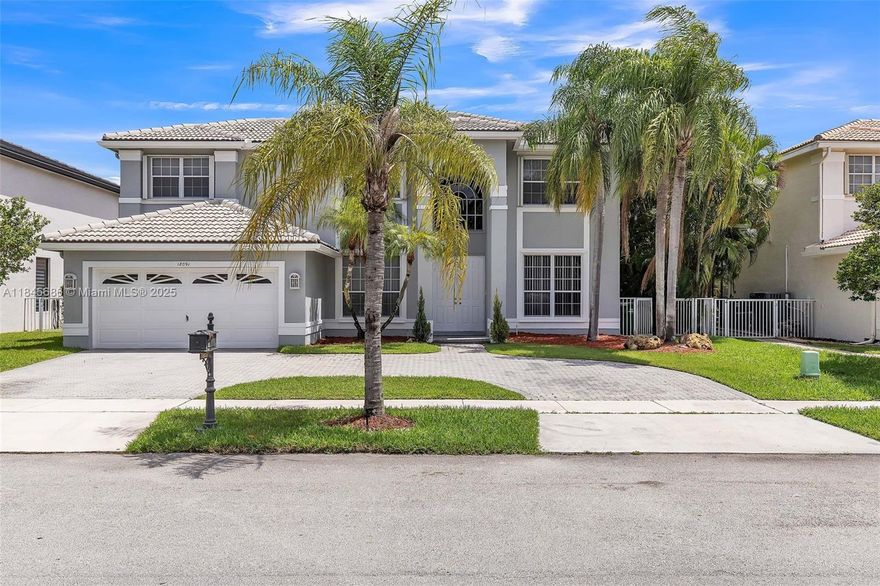 4 bedroom, 3 bathroom pool home with a stunning waterfront view, located in the exclusive gated community of Grand Cay at Silver Lakes in Miramar. The home features tile flooring on the main level and luxury vinyl plank upstairs. The kitchen is equipped with stainless steel appliances and updated cabinets, and it overlooks the pool and lake, offering a serene backdrop for everyday living. The highlight of the outdoor space is the pool and spa combo with picturesque views of the neighborhood lake. All bedrooms are located upstairs with generously sized closets. The primary suite includes a walk-in closet and a spacious en-suite bath with dual vanities, a separate tub, and a walk-in shower. Schedule a tour to discover the rest this home has to offer!