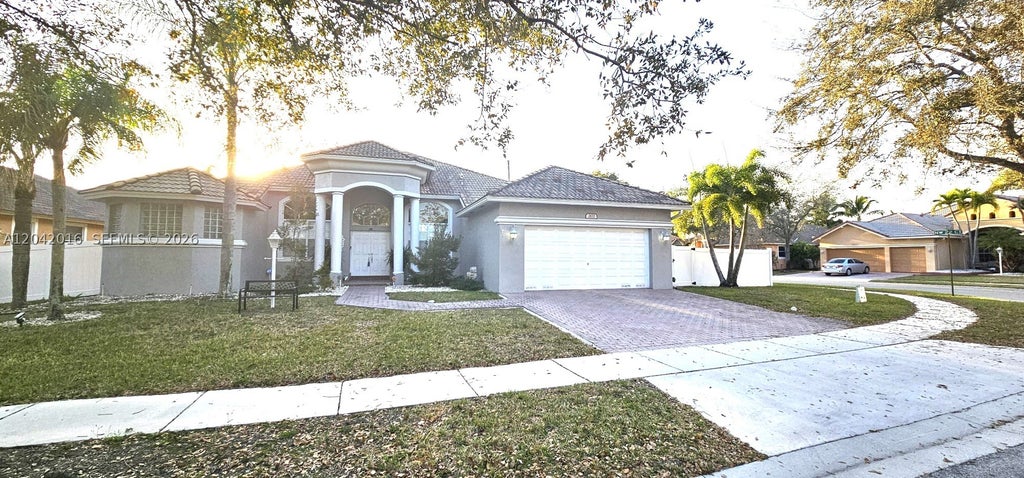 Photo of 2172 NW 139th Ter, Pembroke Pines, FL 33028 (MLS # A12042016)