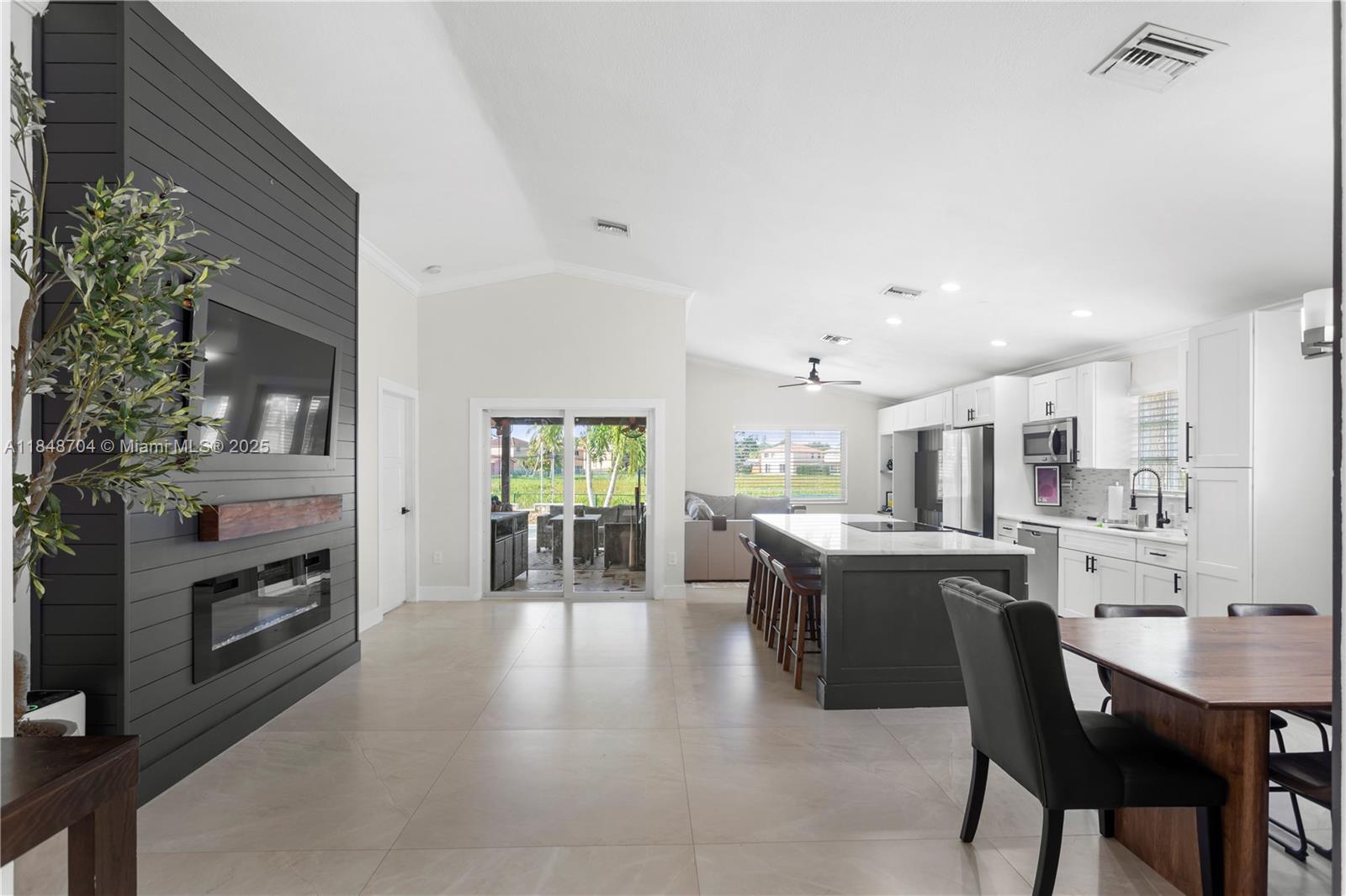 Beautifully remodeled 3BD, 2BR single-family home with an extra room currently being used as a 4th bedroom, located in the community of Walden Lake in Pembroke Pines. The open floor plan connects the living room, kitchen, and dining area for a spacious and functional layout.The primary bedroom includes an en-suite bathroom and is split from the other three bedrooms. All bedrooms are well-sized. Updates include a new roof (2023), impact windows (2023), and a new A/C (2024). The backyard offers a salt-water heated pool, outdoor kitchen, and pergola. With no backyard neighbors and a preserve directly behind the property, enjoy added privacy. Community amenities include a pool, tennis courts, playground, and BBQ pavilion. Located near I-75, US-27, schools, restaurants, and shopping.