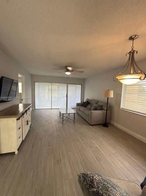 Photo of 6070 NW 64th Ave #312, Tamarac, FL 33319 (MLS # A12014238)
