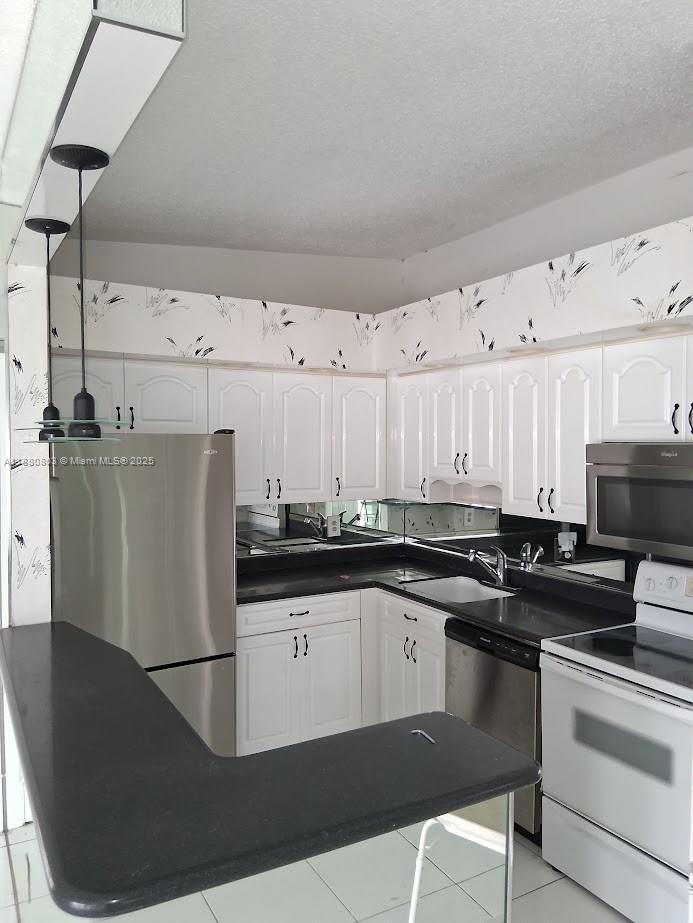 TAMARAC GARDENS CONDOMINI - Residential Lease