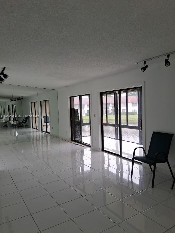 TAMARAC GARDENS CONDOMINI - Residential Lease