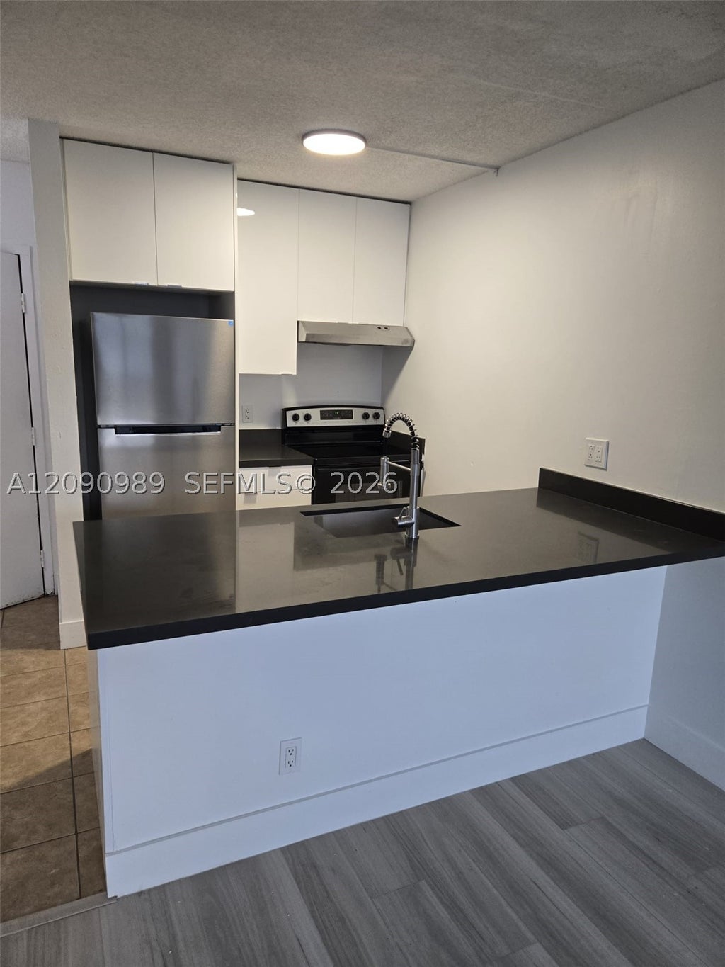 Photo of 2501 Riverside Dr #207-A, Coral Springs, FL 33065 (MLS # A12090989)