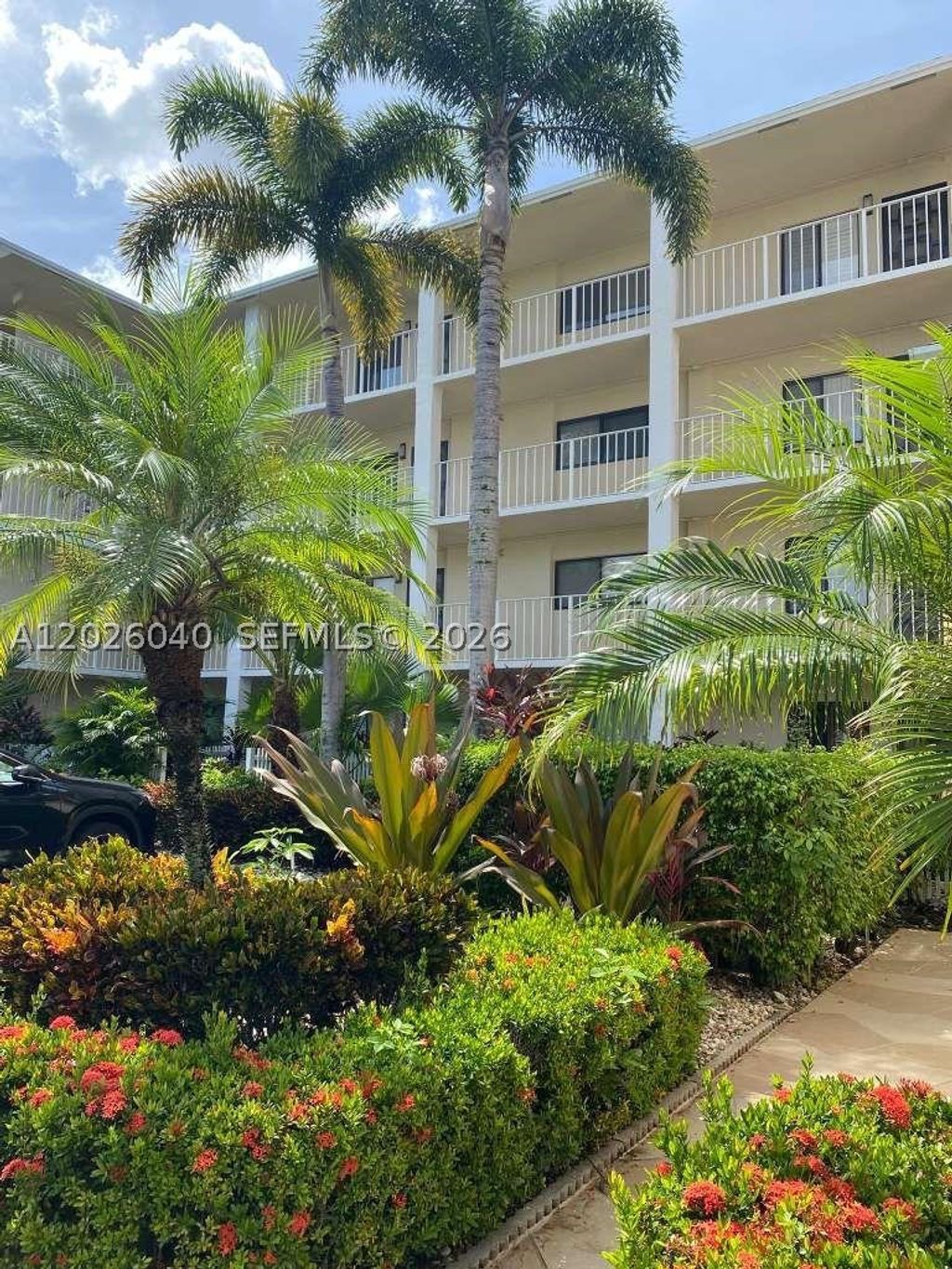 Photo of 7350 Kinghurst Dr #305, Delray Beach, FL 33446 (MLS # A12026040)