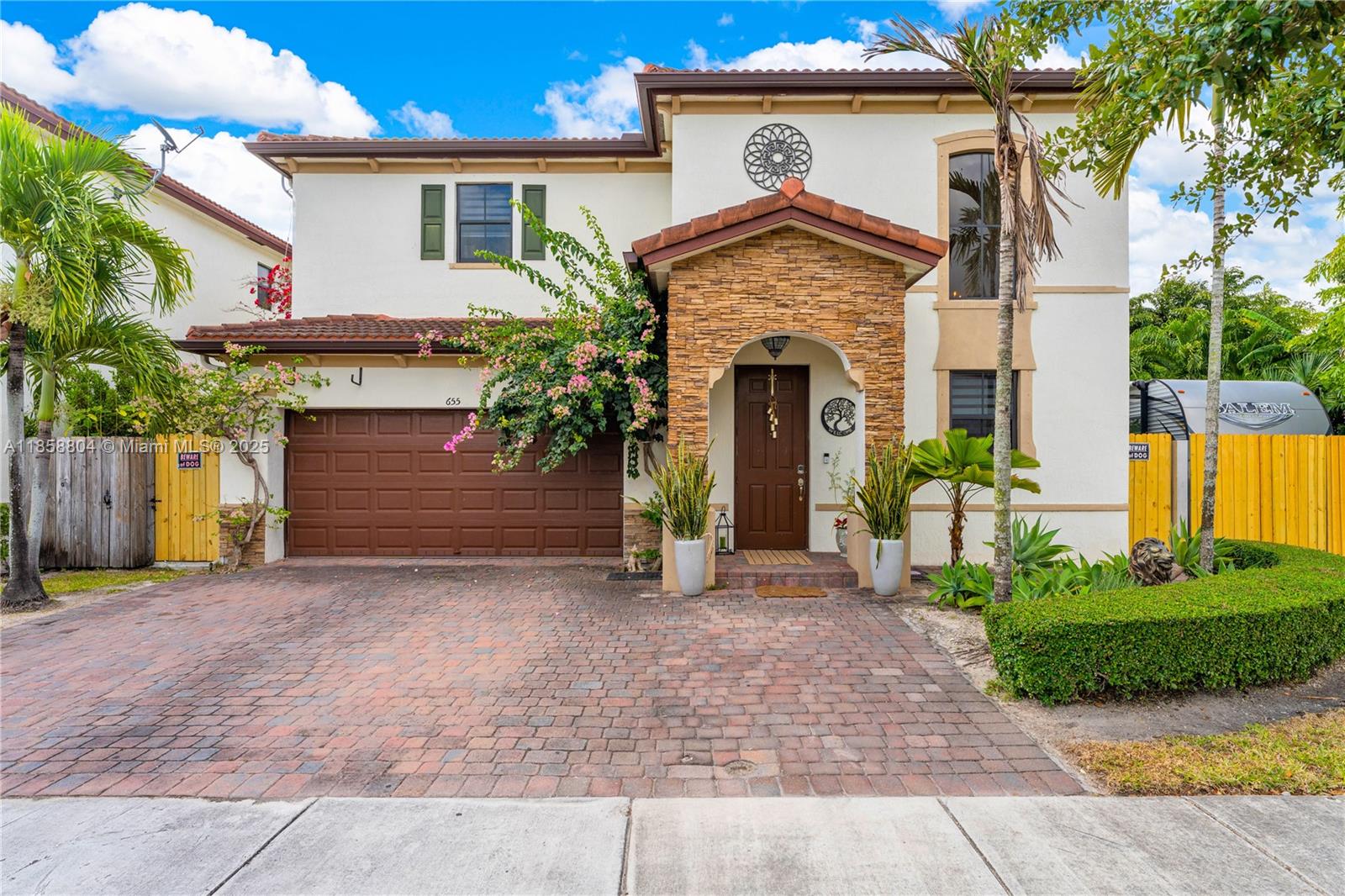 Welcome to this stunning 2 story home in the highly desirable community of Mallorca Gate community. Boasting over 3,000 sq.ft. of living space on an oversized lot, ideal for both everyday living and entertaining. Features 5 bedrooms, 3 bathrooms and an open-concept kitchen with stainless steele appliances and tile flooring throughout the main areas. Recently installed carpet in upstairs bedrooms. The spacious primary suite offers generous closet space. The backyard is very spacious and one of the largest in the neighborhood, featuring lush landscaping with mature trees, vibrant plants and a beautiful pool. A backyard oasis for relaxation and fun. Enjoy resort-style amenities including two pool, waterark, playground, clubhouse, gym and more!