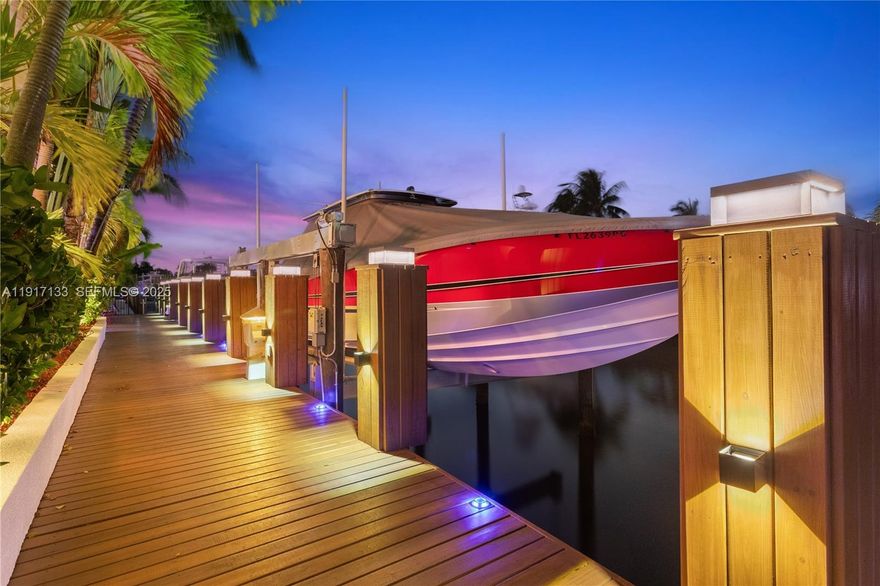 Indulge in this luxurious waterfront retreat in Coral Ridge, where sophisticated living meets boater’s paradise. Boasting 100’ of premium dockage on a wide, deep canal with unrestricted ocean access, a 35,000-lb boat lift, and exceptional comfort, this 4 bed, 3.5 bath residence embodies the waterfront lifestyle. A dramatic great room, expansive dining area, and a chef’s kitchen with top-tier Viking appliances and ADORNUS cabinetry, custom Cambria quartz counters are ideal for grand entertaining or quiet moments. Every space has been remodeled, from serene bedrooms to spa-style baths. Master bath recently updated with 24x24 Greek marble and custom his-and-hers cabinetry with exotic Cristallo quartzite countertops and a spacious shower. Jack and Jill bath features Cambria quartz, porcelain surfaces, generous storage, large mirror, and recessed lighting, while bath #3 offers quartz, travertine, custom cabinetry, and a statement mirror, plus a chic powder room with premium stone counters. A climate-controlled garage includes epoxy floors with space for toys. Whole-house gas generator. Exterior upgrades include new barrel tile roof, gutters, marble pavers, and lush landscaping and lighting enhancing curb appeal. Partial storm shutters and impact glass. Close to beaches, shops, dining, and top schools, this is a rare, turnkey waterfront opportunity.