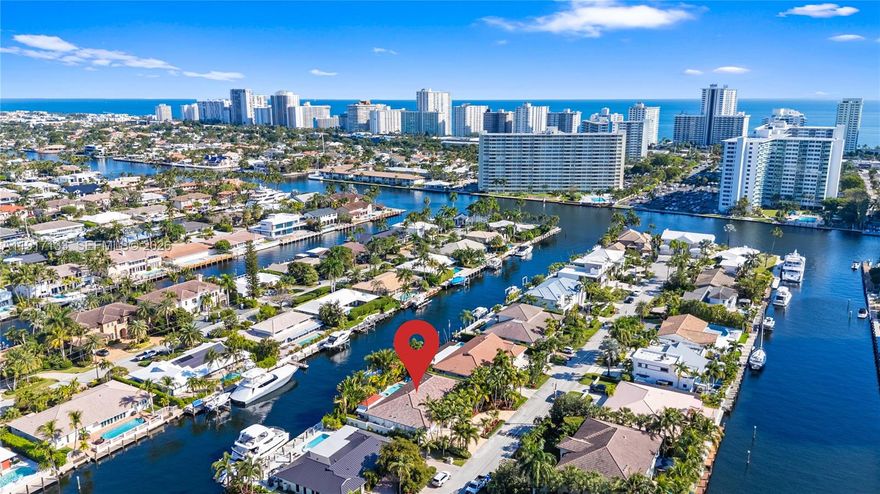 Indulge in this luxurious waterfront retreat in Coral Ridge, where sophisticated living meets boater’s paradise. Boasting 100’ of premium dockage on a wide, deep canal with unrestricted ocean access, a 35,000-lb boat lift, and exceptional comfort, this 4 bed, 3.5 bath residence embodies the waterfront lifestyle. A dramatic great room, expansive dining area, and a chef’s kitchen with top-tier Viking appliances and ADORNUS cabinetry, custom Cambria quartz counters are ideal for grand entertaining or quiet moments. Every space has been remodeled, from serene bedrooms to spa-style baths. Master bath recently updated with 24x24 Greek marble and custom his-and-hers cabinetry with exotic Cristallo quartzite countertops and a spacious shower. Jack and Jill bath features Cambria quartz, porcelain surfaces, generous storage, large mirror, and recessed lighting, while bath #3 offers quartz, travertine, custom cabinetry, and a statement mirror, plus a chic powder room with premium stone counters. A climate-controlled garage includes epoxy floors with space for toys. Whole-house gas generator. Exterior upgrades include new barrel tile roof, gutters, marble pavers, and lush landscaping and lighting enhancing curb appeal. Partial storm shutters and impact glass. Close to beaches, shops, dining, and top schools, this is a rare, turnkey waterfront opportunity.
