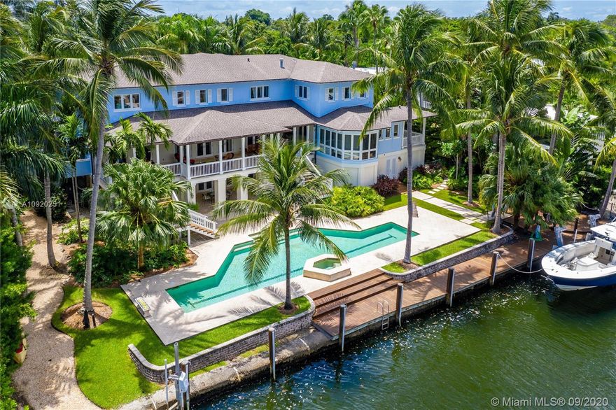 Commanding a lush 1/2-acre Moorings waterfront lot just 3 doors from Biscayne Bay, this idyllic Key West-style residence offers luxury resort-style living in the Grove’s most highly coveted, private gated community. Timeless, classic design, rich architectural details & crisp, clean finishes harmonize with tropical foliage & beautiful views. In addition to its impeccable interiors, the showcase estate features deep verandas, floor-to-ceiling windows, a 2nd-floor wall-to-wall covered terrace, elevator & 4-car garage. Gorgeous grounds encompass 142 waterfront feet, protected dock, 2 boat lifts, opulent open pool/spa & summer kitchen. Moorings bonuses: 3 intimate private parks & community dock; top-tier private schools, fine dining & upscale shopping within mere blocks. Sanctuary in paradise!