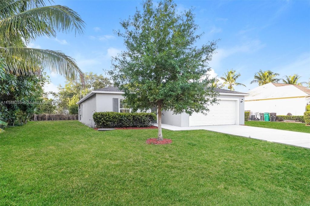 Photo of 486 SW Lawler Ave, Port Saint Lucie, FL 34953 (MLS # A11588255)