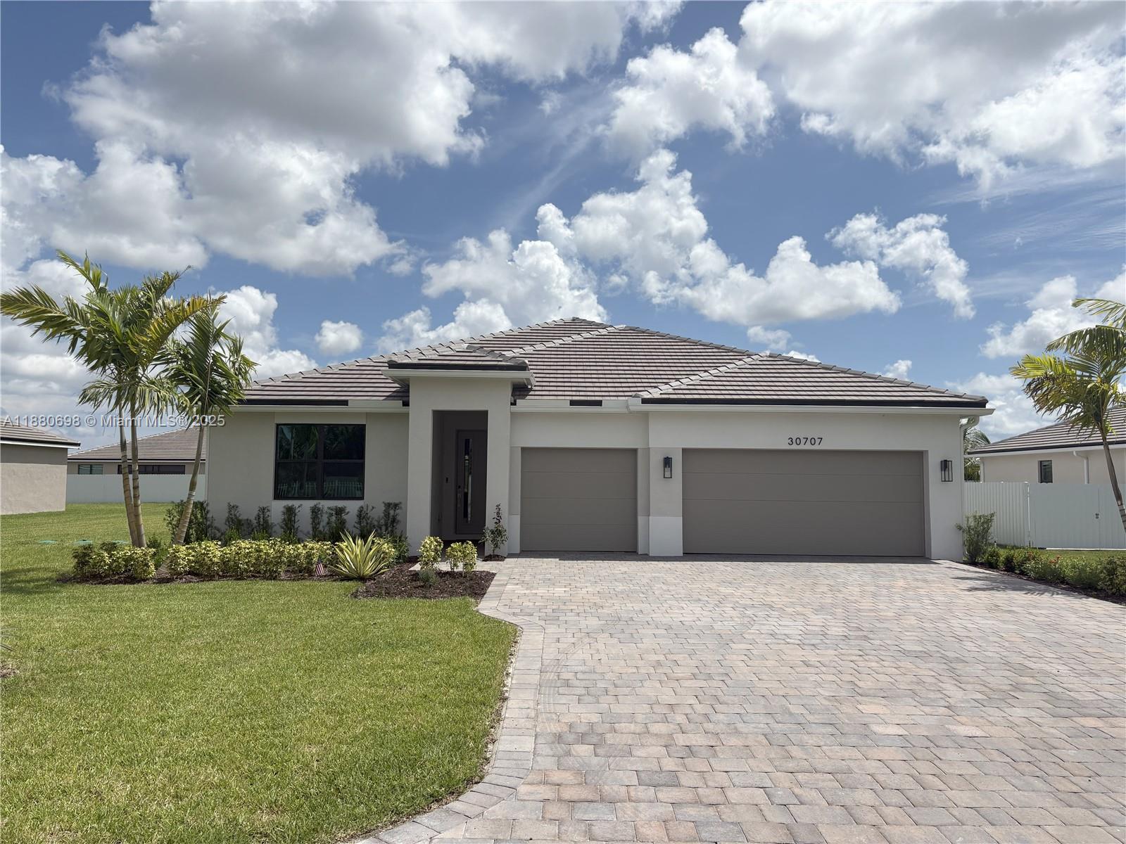 Beautiful New Construction Home! 4Bedrooms, 3Bathrooms 2,533 Sq Ft Living Area. Step into luxury with this stunning brand-new construction featuring builders warranty. Tile floor throughout thoughtfully designed living spaces. The home boasts: Master Suite with an extended walk-In shower and a rainfall showerhead for a spa-like experience. Gourmet kitchen with Quartz counter tops, back splash.Soft-close cabinets, smart stove and smart oven. bathrooms have quartz counter tops. Impact windows throughout for safety and efficiency. Three-car garage equipped with EV charging station for electric vehicles. Modern conveniences paired with timeless finishes. This home blends style, comfort, and smart technology to create the perfect place for your next chapter. Use Google Maps to get to community.