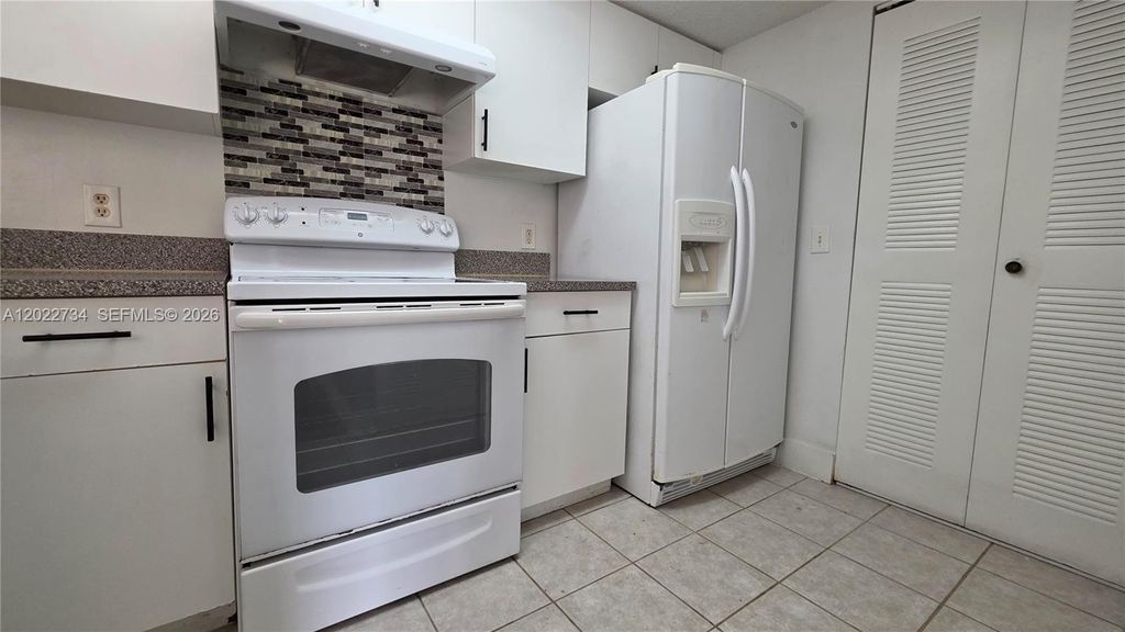 Photo of 5011 Wiles Rd #203, Coconut Creek, FL 33073 (MLS # A12022734)