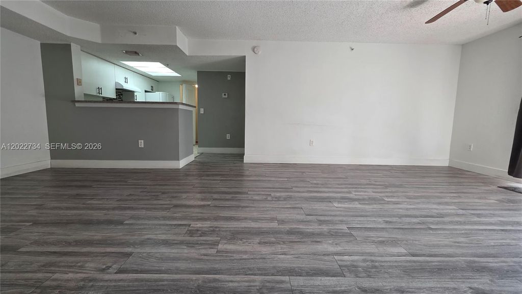 Photo of 5011 Wiles Rd #203, Coconut Creek, FL 33073 (MLS # A12022734)