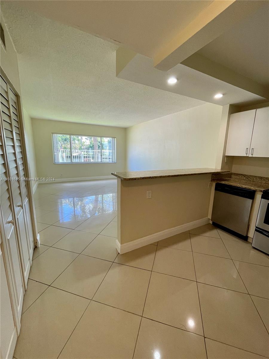 Beautifully renovated 1 bedroom, 1.5 bath condo located in a well-kept and quiet community minutes away from the beach, restaurants, shops, and easy access to i95. Enjoy the canal view from the living room and bedroom, with open kitchen and great natural lighting. Unit features new central A/C and heat, water heater, impact windows, large walk-in closet, dishwasher, stainless steel appliances, kitchen granite countertops, and new bathroom vanities. Large pool and lounge area right on the canal. Includes private parking spot.