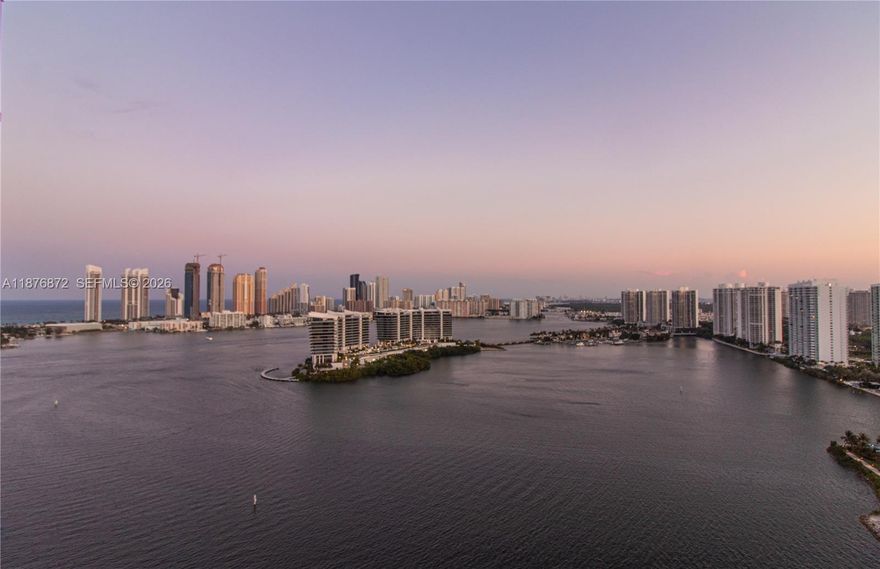 Magnificent Penthouse at Hidden Bay – Aventura
Experience luxurious living at its finest in this stunning 2-bedroom, 2.5-bath, 1,600 sq. ft. penthouse. The spacious “flow-through” layout showcases breathtaking panoramic views of the city skyline, ocean, and Intracoastal through dramatic floor-to-ceiling windows.
Sophistication and comfort with resort-style amenities, including a clubhouse and spa, two sparkling pools, four tennis courts, a party room, and a private marina accommodating yachts up to 65 feet.
Nestled on 24 acres of lushly landscaped grounds and surrounded by water on two sides, Hidden Bay offers serenity, privacy, and 24-hour security. Enjoy peaceful walks along the marina. Just steps from Aventura Mall, Founders Park, top-rated restaurants, and premier schools.