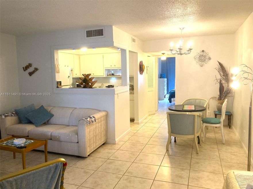 Reduced, Motivated Seller! Spacious 1/1.5 with screened Florida room overlooking the garden - recently painted - Ceramic tile floors, spacious bedroom with walk-in closet, new vanity in master bath + powder room. low HOA. Building 4 passed 40 year inspection, no major repairs needed. New AC & water heater.  55+ community with 3 pools (2 heated) with an array of activities & entertainments - Club House with Ball room, Card room, Ping Pong & Billiard rooms, Pickleball, Bocci, Gym & Sauna, Library, BBQ, and much more. Ready to move in, conveniently located on 3rd floor with elevator, near pools & Club House. Complex well maintained, near shops, highways and all services. Sold AS IS - all furnished, ready to move in.
