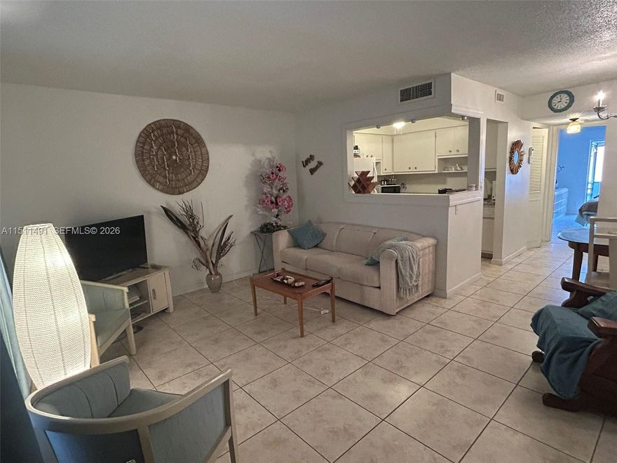 Reduced, Motivated Seller! Spacious 1/1.5 with screened Florida room overlooking the garden - recently painted - Ceramic tile floors, spacious bedroom with walk-in closet, new vanity in master bath + powder room. low HOA. Building 4 passed 40 year inspection, no major repairs needed. New AC & water heater.  55+ community with 3 pools (2 heated) with an array of activities & entertainments - Club House with Ball room, Card room, Ping Pong & Billiard rooms, Pickleball, Bocci, Gym & Sauna, Library, BBQ, and much more. Ready to move in, conveniently located on 3rd floor with elevator, near pools & Club House. Complex well maintained, near shops, highways and all services. Sold AS IS - all furnished, ready to move in.