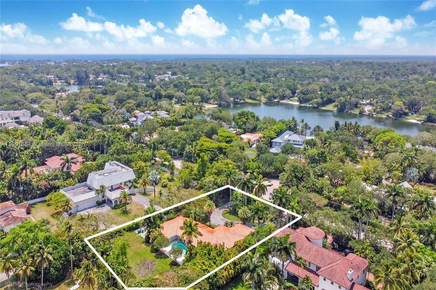 Generous one story floorplan lots to enjoy and so much room to add value! Fully gated, Acre-plus property and updated one-story home in coveted Ponce Davis, adjacent to Coral Gables, Pinecrest and South Miami and in close proximity to the best schools and easy commute to business centers and airport. Spacious living areas, updated kitchen and generous primary suite all open to the covered terrace, pool area, BBQ gazebo and expansive yard. A functional split bedroom floor plan, newly built out closets, impact windows and doors and updated bathrooms allow for easy move- in while planning for further upgrading.