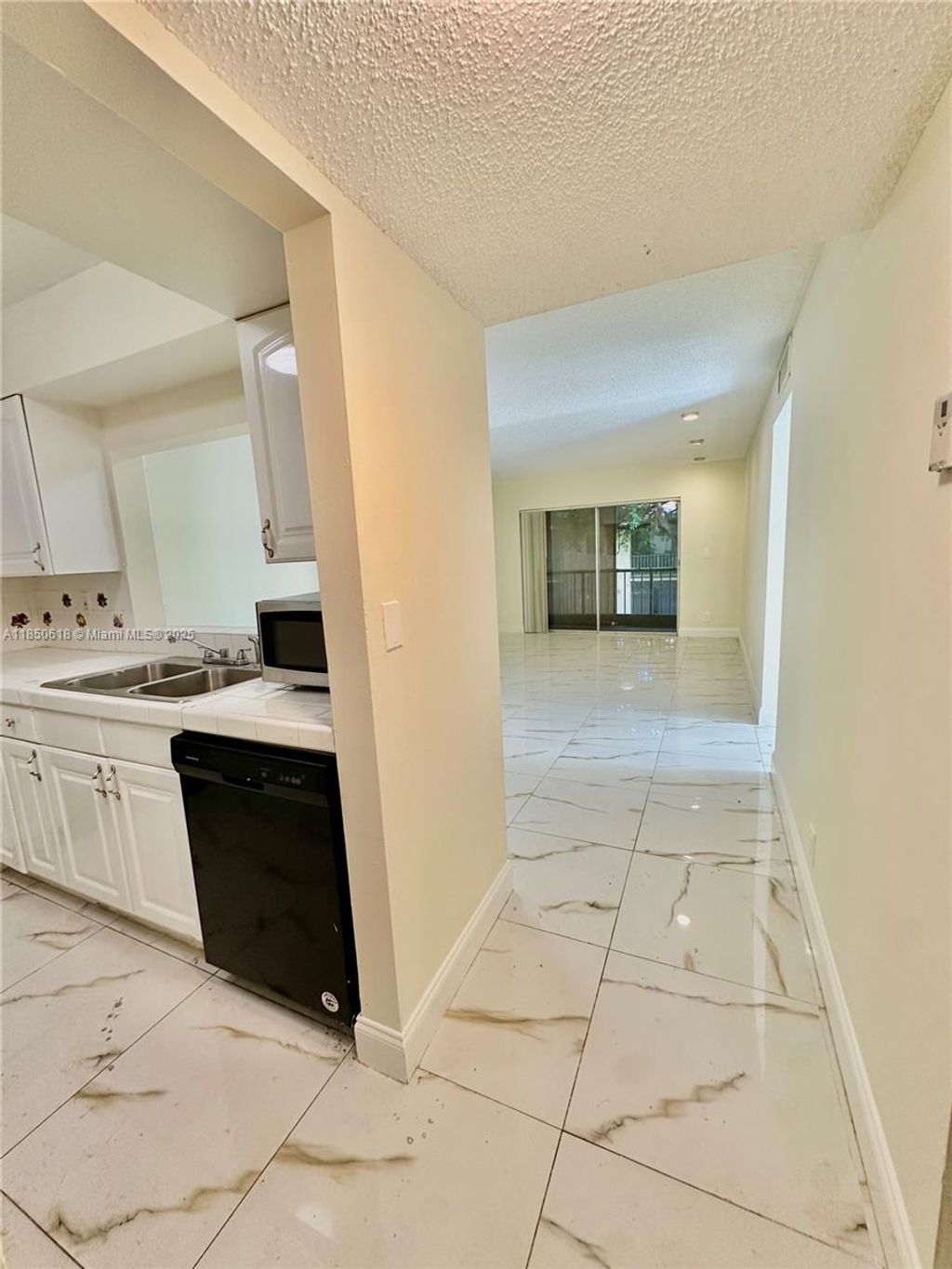 Photo of 4141 NW 90th Ave #206, Coral Springs, FL 33065 (MLS # A11850618)