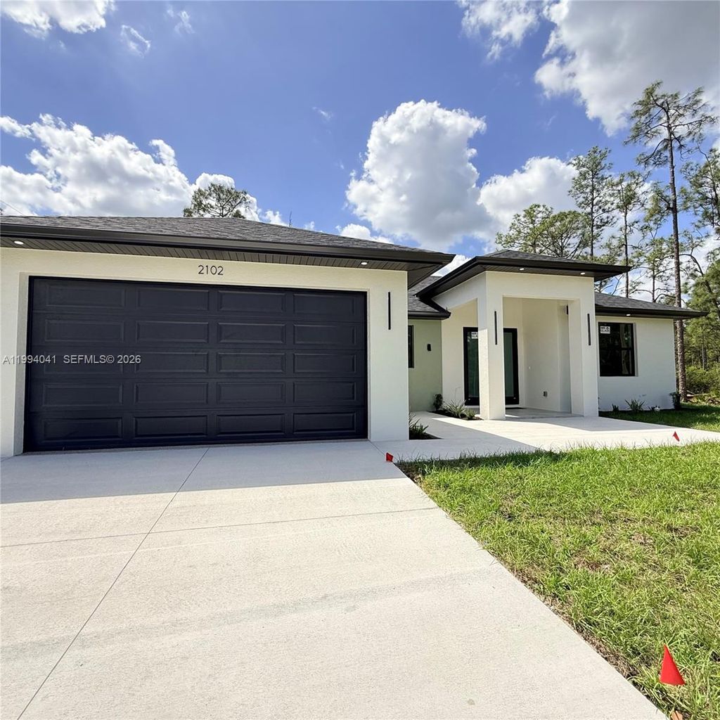 Photo of 2102 E 13th St, Lehigh Acres, FL 33972 (MLS # A11994041)