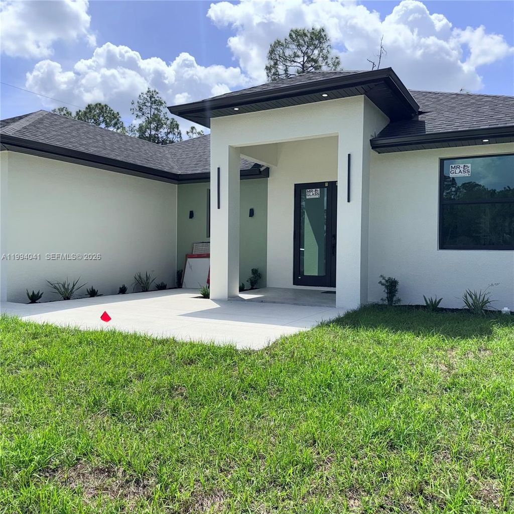 Photo of 2102 E 13th St, Lehigh Acres, FL 33972 (MLS # A11994041)