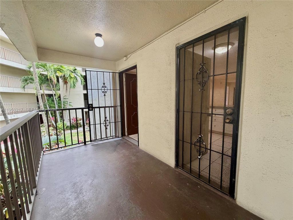 Photo of 2320 S Cypress Bend Dr #206, Pompano Beach, FL 33069 (MLS # A11950217)