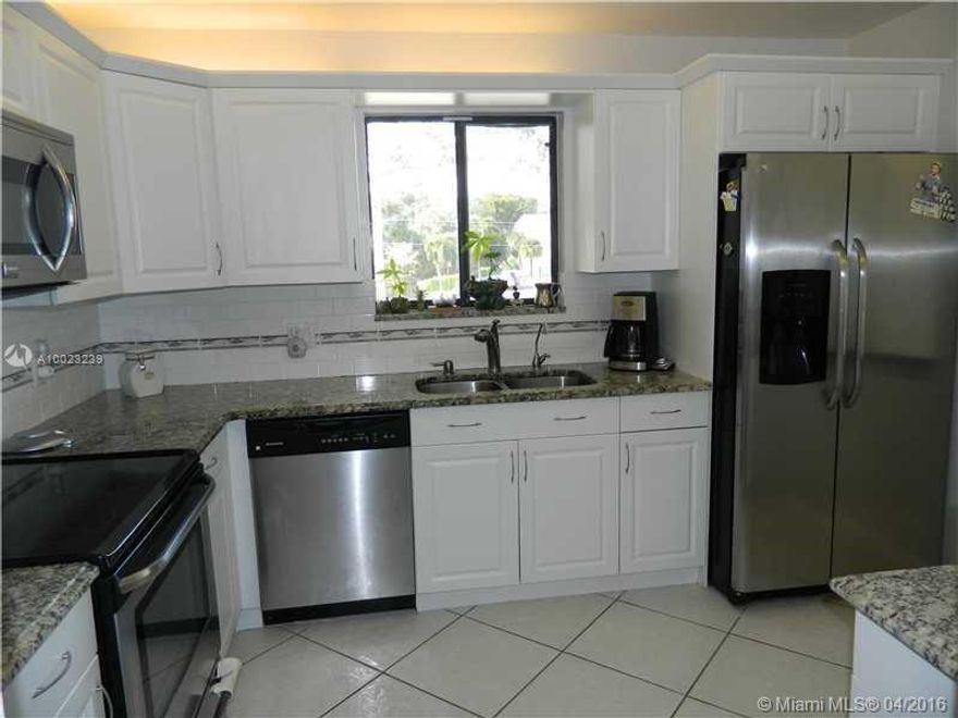 2/2 corner. Remodeled kitchen cabinets, stainless steel appliances & granite. Large master bedroom w/sitting area. Bathrooms with granite countertops & new sinks. Neutral color tiles throughout. Painted in neutral colors. Foyer features glass block providing more natural light. Washer & dryer inside the unit. Two balconies, front & back. Screened balcony & has additional storage closet. Hurricane shutters. Live the Bonaventure Town Center Club lifestyle. Available furnished or unfurnished.