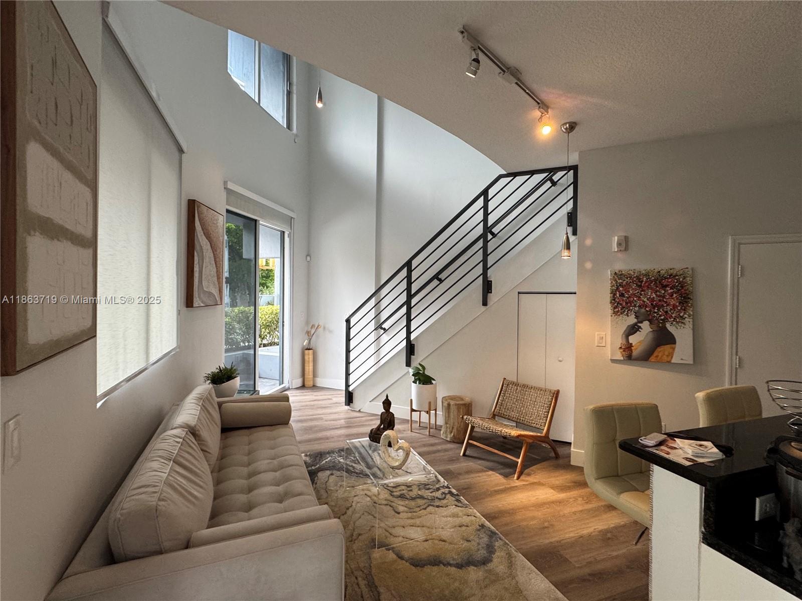 One of the few Work/ Live Condos authorized in the city. In the heart of coconut grove. This work live unit has two first floor entry options. Walk up from the sidewalk or main building entrance with sitting area right outside your door. Ideal for business owners who like a modern two story unit with high ceilings and plenty of light. Please do not bother current tenant by knocking etc. Association fees additional.