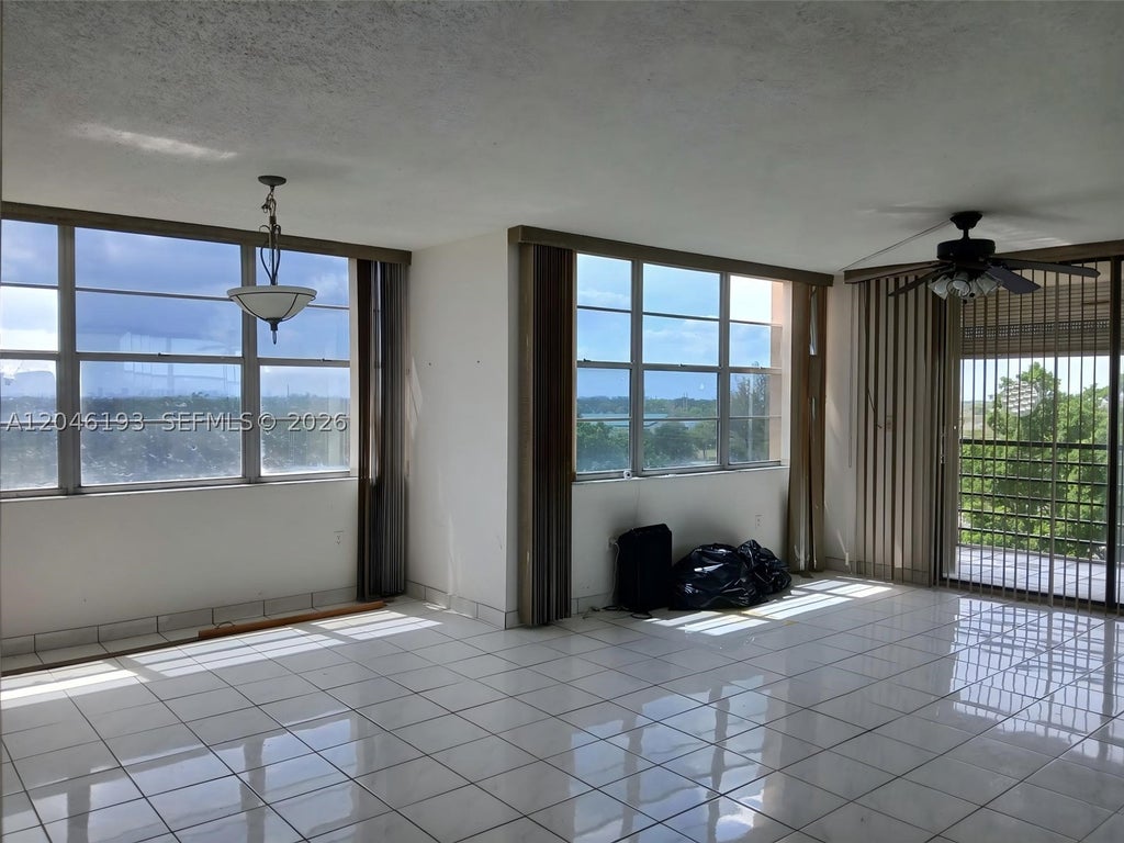 Photo of 1100 Saint Charles Pl #719, Pembroke Pines, FL 33026 (MLS # A12046193)