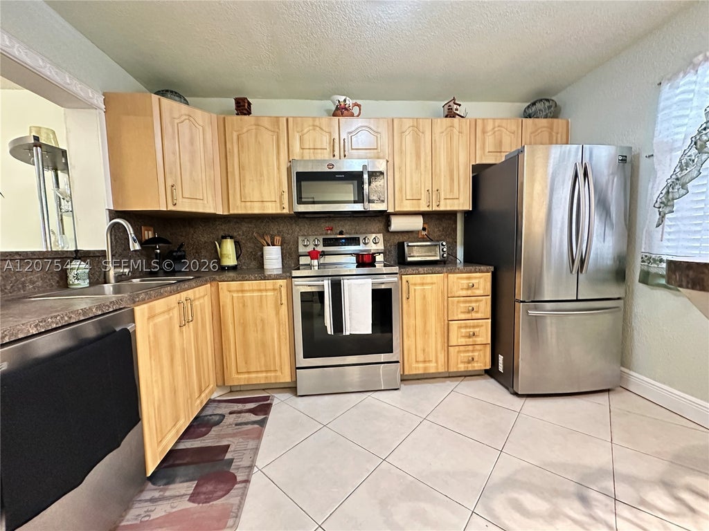 Photo of 3910 Inverrary Blvd #202-B, Lauderhill, FL 33319 (MLS # A12075474)
