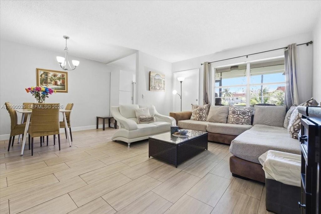 Photo of 581 Blue Heron Dr #205-B, Hallandale Beach, FL 33009 (MLS # A11990035)