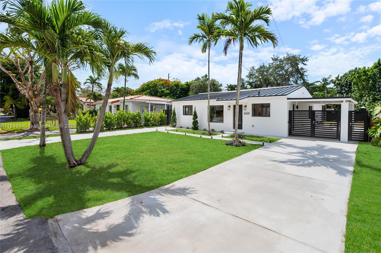 Welcome to your move-in-ready home in prestigious Schenley Park! This modern 3BD/2BA gem sits on an expansive 9,000 sq ft lot, offering a backyard oasis, two spacious driveways, a covered carport, and a brand-new fence. Enjoy peace of mind in this fully renovated home featuring a new metal roof, impact windows and doors, new electrical and plumbing systems, and new septic. Experience an open-concept layout with flexible spaces. The primary suite sits in its own private wing. The gourmet kitchen features quartz countertops and high-end finishes, while the stylish bathrooms and porcelain tile throughout add a sleek, modern touch. All in a no-flood zone, near Coral Gables, great schools, and everything you need! This is not just a home—it’s a lifestyle upgrade.