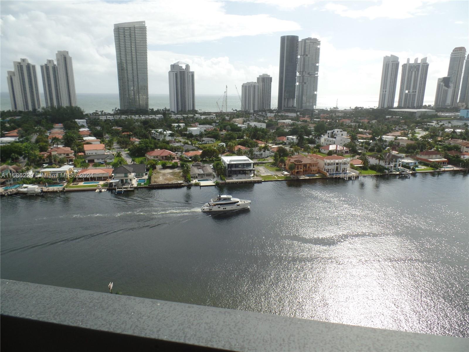 SPACIOUS & AIRY PREVIOUSLY RENOVATED BAYFRONT BEAUTY WITH FULL OCEAN VIEWS FROM THIS HIGH FLOOR, FULLY FURNISHED & COZY! STAINLESS STEEL APPLIANCES, EAT-IN-KITCHEN, NEW WASHER & DRYER IN UNIT, KING SIZE BED! TILED TERRACE WITH BOTH BAY & OCEAN VIEWS! CUSTOM BUILT WALK-IN-CLOSET! GREAT POOL, JACUZZI, FITNESS ROOM, TENNIS & PICKLEBALL COURTS, CONVENIENCE STORE, NEW RESTAURANT, SPA W NAIL AND HAIR SERVICES, GATED NEW CHILD PLAYGROUND AS WELL AS MESMERIZING BAYFRONT PROMENADE WITHIN THIS 24 HR SECURITY GATED COMMUNITY! BEST DEAL IN THE AREA!!!