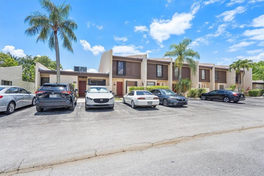All ages welcome! Welcome to the perfect, budget-friendly starter home for a small family, located right in the heart of Pembroke Pines. Finding a completely turnkey, move-in-ready 2-bedroom, 2.5-bathroom townhouse under $300k in this area is a rare find, offering an incredible opportunity to own for less than the cost of renting!

The bright, tiled main floor features a spacious living area with a modern ceiling fan and large sliding glass doors opening to a private patio oasis. The functional layout seamlessly connects the dining room to a lovely kitchen equipped with light wood cabinetry, granite countertops, a stainless steel range, and an in-unit stacked washer/dryer. A main-floor half-bath adds great convenience for guests.

Upstairs, both bedrooms serve as peaceful retreats with warm wood-look laminate flooring and private en-suite setups. The primary bathroom features a stunning, upgraded glass-enclosed walk-in shower with modern blue-grey tile.

Complete with assigned parking right at your front door, this beautiful home is ready for you to pack your bags and move right in. Schedule your private tour today before this affordable gem is gone!