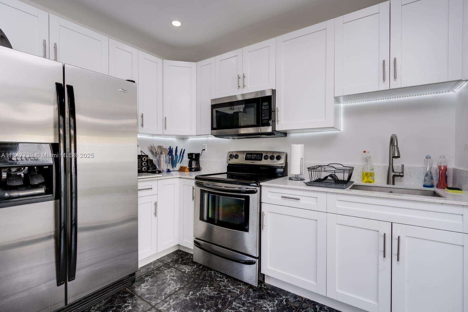 Beautifully remodeled home with no HOA on a quiet street. Ideal for a primary residence or investment opportunity such as Airbnb. Recent upgrades include a 2023 roof, A/C, modern kitchen with granite countertops, updated bathrooms, and new lighting throughout. The main home offers 3 spacious bedrooms with closets and 2 baths, plus a separate attached suite with private entrance—perfect for guests or rental income. Large, fenced backyard ideal for entertaining (new pvc fence being installed). Covered carport with washer/dryer. Prime location near I-95, Sunrise Blvd, Las Olas, beaches, FLL, and more. Tenant occupied—please do not disturb. See broker remarks for showing instructions.