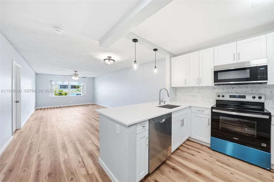 Beautifully condo located in the desirable Monaco Garden community. 13 MINUTES FROM THE BEACH! This unit offers a modern open layout perfect for entertaining along with a spacious, private balcony. Two large bedrooms each with their own  full bathrooms. The interior has been thoughtfully updated, from floors to kitchen, bathrooms, brand new electrical panel, stainless steel appliances and much more making this an absolutely move-in-ready home, including shutters in each window. Enjoy the convenience of living in a well-maintained community with a brand new roof. Close to shopping, dining, and major roadways such as I-95, Federal Highway and Hillsboro Boulevard. A great opportunity in an ideal Deerfield Beach location.