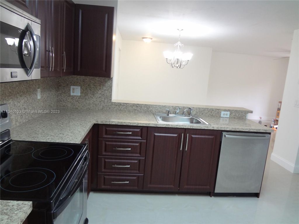 Photo of 10125 W Sunrise Blvd #104, Plantation, FL 33322 (MLS # A11340103)