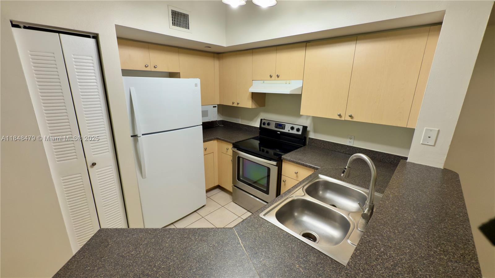 Spacious 2 bed 2 bath condo in gated Emerald Isle at Laguna Lakes. Second floor home with 1060 sq ft and a comfortable split layout. Community offers pool, spa, fitness center, clubhouse, tennis, racquetball, basketball and playground, plus lake views and roving security. Excellent location near I 95, the Turnpike, shopping and beaches. Available the first two weeks of August. Association approval required. Request showings through ShowingTime to receive gate and lockbox instructions. Easy to show.