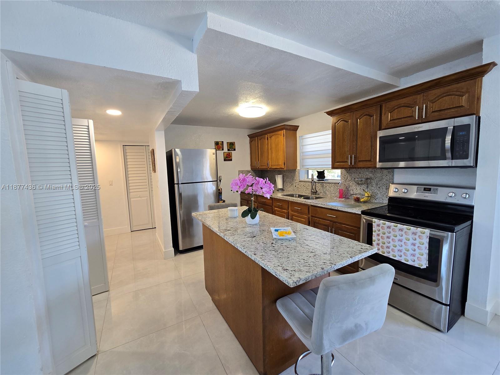 Completely updated, Lake View oversized Corner Unit 1/1.5 condo. 1 level unit in Beach Club at Fontainebleau. Impact windows and sliding door. Open kitchen with granite countertops custom island with, wood kitchen cabinets, tile floor throughout home, large master bedroom with walk in customized closet, and updated bathrooms. Full size Laundry room inside the unit. Oversized balcony with lake views. Community features a Gym, 3 pools, tennis court, racquetball court and kids playground. LOW HOA FEES. For investors unit can be rented at $2100+ a month. Truly a must see to appreciate. Call to schedule a tour today.