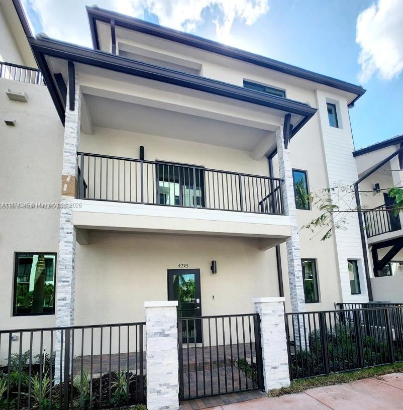 Beautiful 3-bedroom 2 full bath 2 half bath townhome with 2-car garage featuring modern kitchen with stainless steel appliances spacious family room master suite with walk-in closet spa-inspired bathroom and private balcony plus Skyview Terrace perfect for entertaining located in Urbana Doral with resort-style amenities walking distance to shops restaurants and top-rated schools minutes from Miami International Airport and major highways