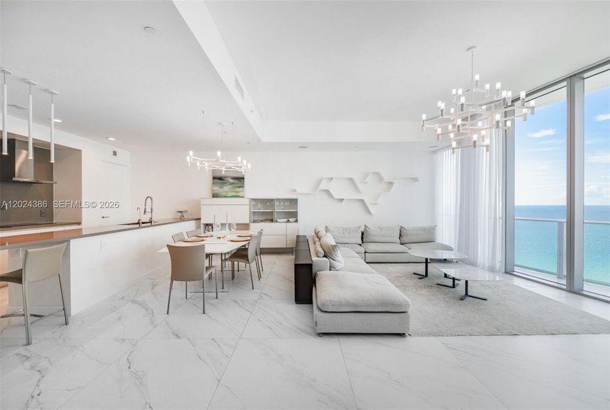 Spectacular panoramic views of the Atlantic Ocean, Intracoastal, and dazzling city skyline from this exceptionally sophisticated residence. This stunning 2-bedroom + den, 3-bath . Den has been thoughtfully converted into a spacious 3rd bedroom, offering both comfort and versatility.
Designed for elevated living, the residence features a state-of-the-art open-concept kitchen with premium high-end appliances, custom designer finishes, and sleek contemporary details throughout. Floor-to-ceiling windows and electric shades enhance both style and convenience.
Experience resort-style living in one of the most prestigious full-service oceanfront buildings in Sunny Isles Beach, featuring a private elevator entry, impeccable finishes, and world-class amenities. Residents enjoy infinity-edge pools, private beach service, a luxurious spa with sauna, steam rooms, massage facilities, a state-of-the-art fitness center, children’s playroom, elegant social lounge, cigar bar, private theater, and 24-hour concierge and valet services.