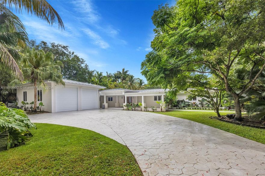 Located in beautiful Pinecrest, this estate property consists of a main house & guest house on a near acre of land sharing a pool and expansive lawn. Ideal for a big extended family, the main house features 5 bedrooms, a central playroom, large kitchen with upgraded appliances, bar and large living room leading out to the pool patio with covered trellis overlooking the expansive back yard. The guest house features a gym, media room, safe room, full kitchen and bedroom suite. The property is storm ready with a 30kw solar panel array with IQ8 battery backup system for 100% off the grid power supply. The large 2 car garage features oversized doors for a boat on trailer. Fully fenced w/ double entry auto gates & concrete driveways. No trees in bldg footprint for those looking to build anew.