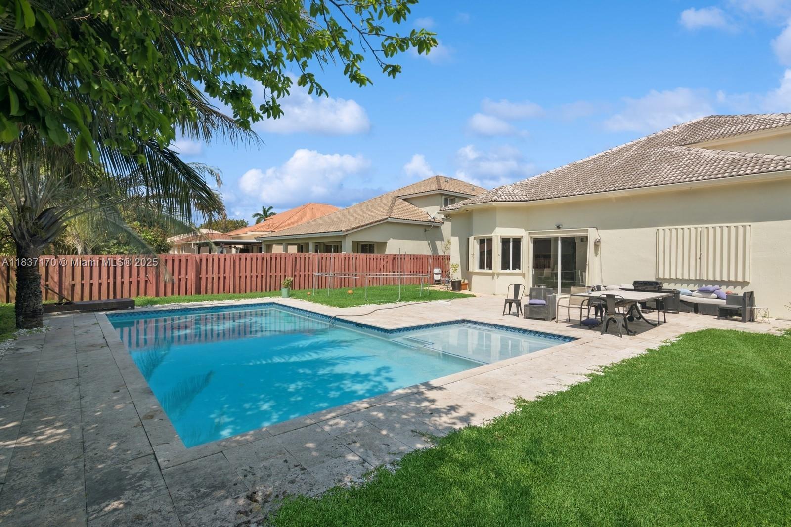 Large Pool and Patio to play in. Big fenced backyard is perfect for entertaining! This is the one you have been waiting for! Beautiful 4 bedroom, 2.5 bathroom home in the Keys Gate Community of The Shores! This home has it all, and features tile floors throughout the first floor, with laminate upstairs! Kitchen has been recently remodeled and includes two-tone cabinetry, stainless steel appliances, quartz counter tops, upgraded fixtures, and more! Huge owner's suite with high ceilings and custom closet! Master bathroom has also been tastefully upgraded! Association includes cable, alarm, and internet! Our community has access to the pickle ball and tennis courts across the street in the Keys Gate golf course. Make your appointment today, as this one will not last