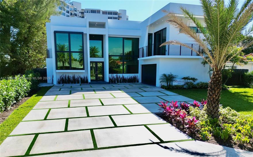 New Construction, stunning two-story contemporary home in the San Souci neighborhood of North Miami, Florida, offers the ultimate in luxury living. With over 4,200 sqft of living space, 4 spacious bedrooms, 4 and a half luxurious bathrooms.This home also features two master suites, one on each floor, providing even more flexibility and comfort High-end features include volume ceilings, impact windows and doors, relaxing pool area, steam shower in the master bathroom, a custom floating wood staircase, and a large terrace with breathtaking views of the pool area and water.  The kitchen is a cook's dream with extensive space and cabinetry. There is a laundry room on both the upper and lower levels for added convenience. . Don't miss the chance to make this magnificent property yours!