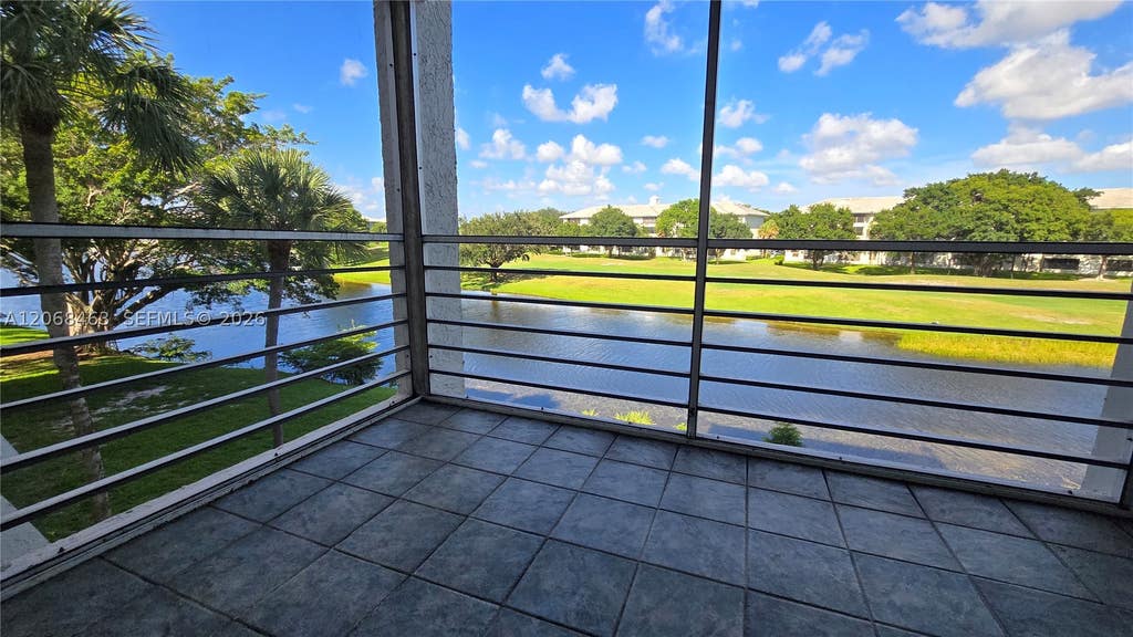 Photo of 9230 Lagoon Pl #310, Davie, FL 33324 (MLS # A12068463)