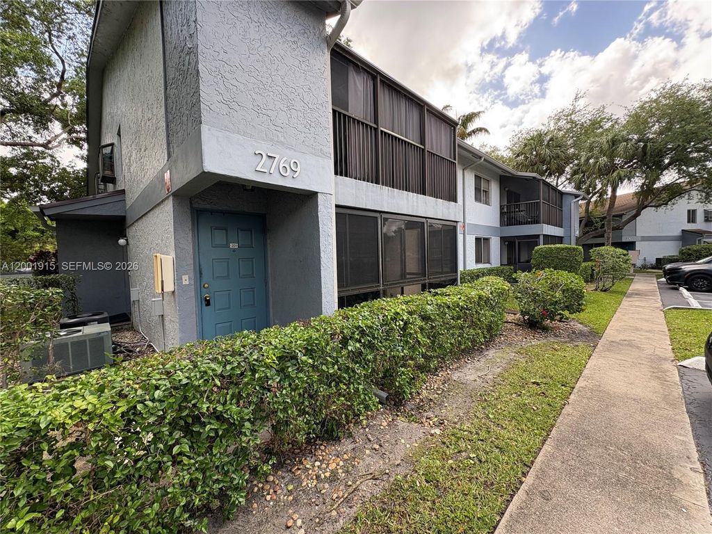 Photo of 2769 S Oakland Forest Dr #101, Oakland Park, FL 33309 (MLS # A12001915)
